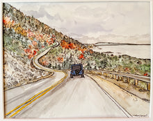 Load image into Gallery viewer, A blue jeep heads north down the winding cabot trail, in the cape breton highlands in early fall
